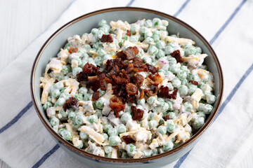 Homemade Creamy Bacon Pea Salad in a Bowl, side view.