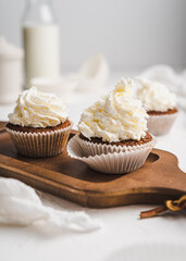 muffin cupcake paper mold carrot cake topped with whipped cream and berries