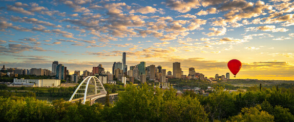 Edmonton cityscape and skyline with the view of a red hot air balloon over Walterdale Bridge in...