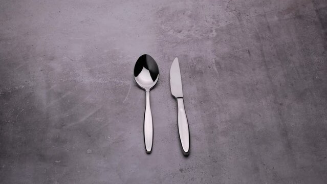 Serving dishes on the table, spoon and knife, cutlery video
