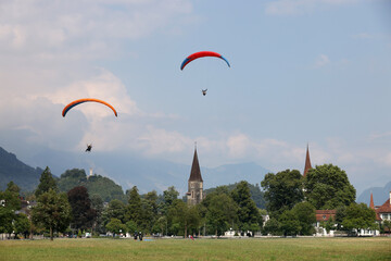 Paragliding in Interlaken, Switzerland, Europe. Interlaken is famous resort in paragliding flights