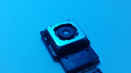 closeup of mobile camera component in clear blue background quality image by Mr production 