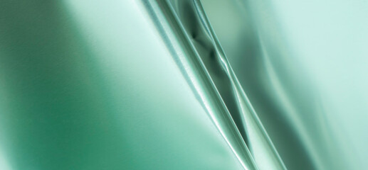 green bent metal sheet with visible texture. background