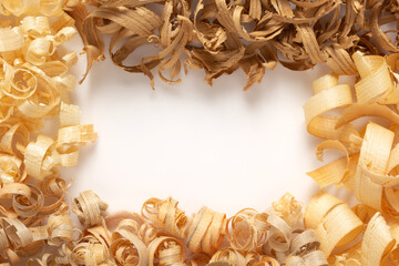 Wood shavings isolated at white background. Wooden curls on white