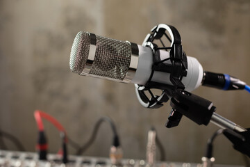 Microphone and sound mixer at audio mixing console. Music concept in sound recording studio
