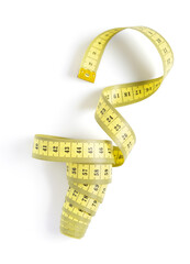 Tailor measuring tape isolated at white background, top view. Tape measure on white