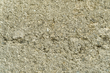 Concrete or sandy gray fence surface. solid background