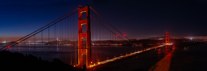 Large panorama of blue hour of the Golden Gate Bridge and cityscape in the early morning from Marin headlands
