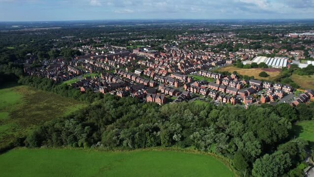 Aerial footage over a British housing estate, English houses and homes from above estate agent