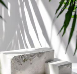 Stone product display podium on white background