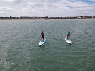 Paddleboarders in the North Sea, off Withernsea