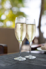 Two glasses of champagne in a restaurant on the coast of a resort in the Maldives
