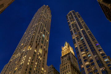Fototapeta na wymiar New York City, Old skyscrapers on Broadway, financial district of New York at night time. High-quality photo