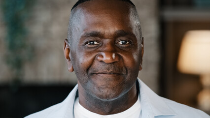 Elderly male portrait indoors of african american adult 50s man biracial senior businessman...