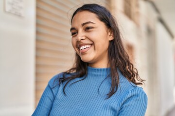 Young african american woman smiling confident standing at street