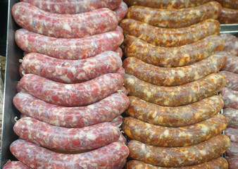 close up on raw sausage for sale in store