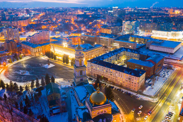 Aerial view of snow covered Lipetsk cityscape with central Cathedral square and Nativity of Christ Church in winter twilight, Russia