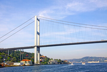 Obraz premium Bosphorus Bridge (also called the First Bosphorus Bridge) over the Bosphorus strait in Istanbul, Turkey. Built in 1973 and connecting Europe and Asia
