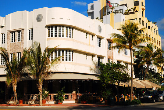 A curving Streamline Moderne Art Deco building stands on the corner in Miami Beach, Florida