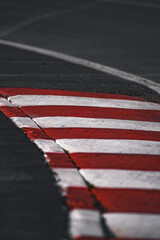 red and white kerb on formula one racetrack 