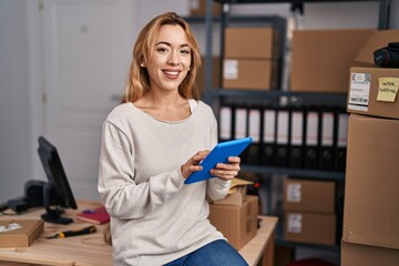 Young woman ecommerce busines worker using touchpad working at office