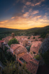 High angle view of the city landscape of Moustiers-Sainte-Marie at sunset, a French town in...