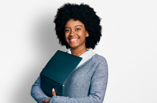 Young african american woman working using computer laptop smiling with a happy and cool smile on face. showing teeth.