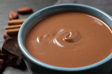 Yummy hot chocolate in cup on table, closeup