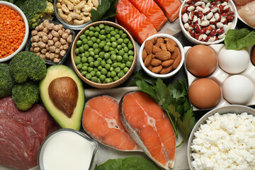 Products rich in protein as background, flat lay