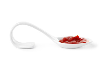 Ketchup in ceramic serving spoon isolated on white