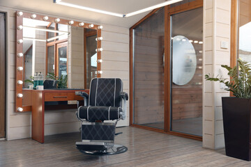 Obraz premium Hairdressing salon interior with large mirror and chair