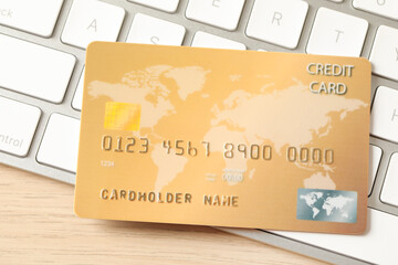 Online payment concept. Bank card on computer keyboard, closeup
