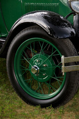 Beautiful Antique Green Car Spoke Wheel and Fender