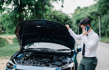Asian businessman broken car engine breakdown, Streesed emotion, Accident emergency on the road concept.
