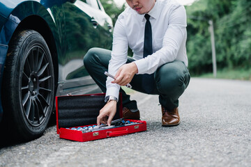 Asian businessman broken car engine breakdown his stressed emotion problem, Accident emergency on the mountain road outdoor late for work concept.