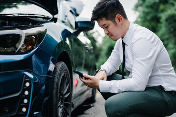 Fototapeta na wymiar Asian businessman broken car engine breakdown his calling insurance stressed emotion problem, Accident emergency on the mountain road outdoor late for work concept.