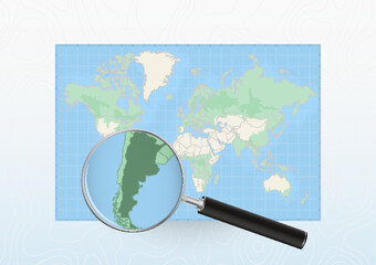 Map of the World with a magnifying glass aimed at Argentina, searching Argentina with loupe.