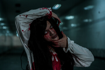 Girl ghost woman death with blood the horror is screaming darkness and nightmare dark background,...