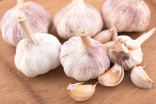 Fresh garlic still life on cutting board