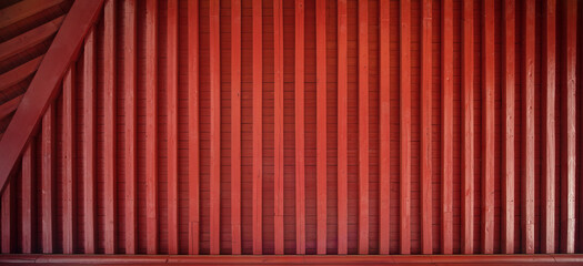 The red background wall made of dark red wood products in ancient Chinese style