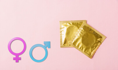 World sexual health or Aids day, Top view flat lay condom in wrapper pack and Male and female...