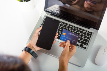 Woman hands holding credit card and smartphone with product purchase at home, Female register via...