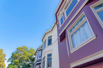 Colorful complex townhomes in a low angle view in San Francisco, California
