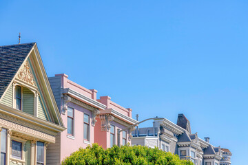Peak of residential buildings with queen anne victorian style exterior in San Francisco, California