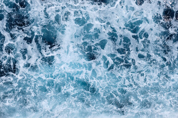 Deep ocean top view. White water wave perspective. Sea water ship trail with white foamy wave....
