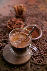 Cup Of Coffee And Coffee Beans On Table.