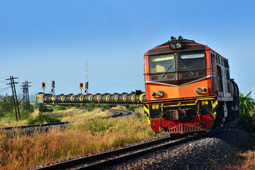 Tanker-freight train by diesel locomotive on the railway