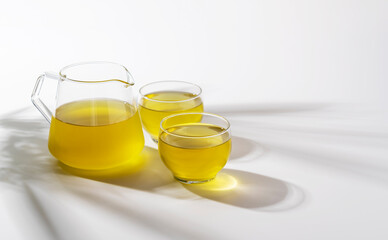 Cold green tea placed on a white background.