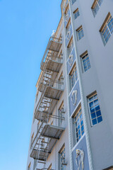 Low angle view of a multi-storey apartment with ornamental wall display and decorative beading