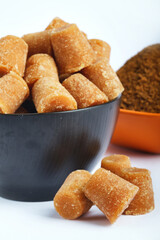 Organic Gur or Jaggery Powder and cubes, Jaggery is used as an ingredient in sweet and savoury dishes in the cuisines of India.